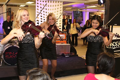 CoverGirls Violin Show provided musical entertainment at the Event Industry Holiday Party on the trade show floor.