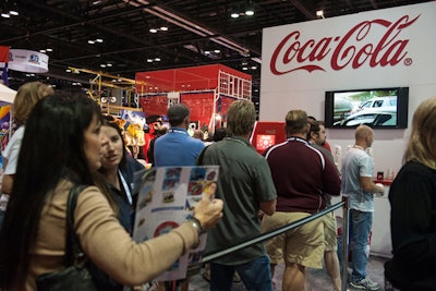 Coca-Cola attracted a crowd to its booth by offering samples from a Coke Freestyle machine.