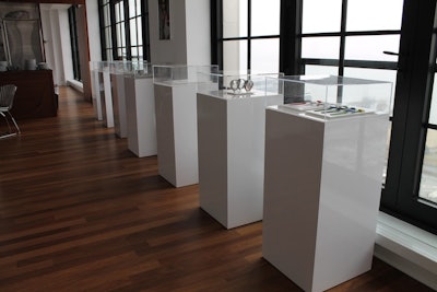 RentQuest's custom display cases showcase watches and jewelry at an event.