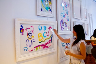 Guests could paint their doodles inside framed canvases on the wall.