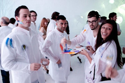The invitation instructed guests to wear all white, with the note that 'protective gear' would be provided. At the event, guests could don white coats to prevent paint from splashing on their outfits.