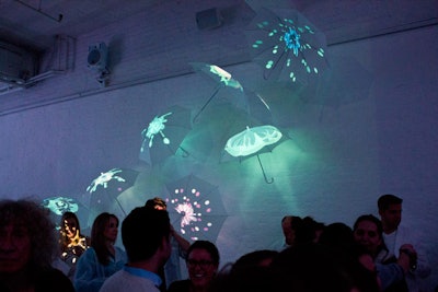 As the night progressed, splashes of color were introduced through projections on an installation of umbrellas.