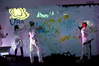On the stage's backdrop, colored projections added points of color, shapes that grew as the performance drew to an end.
