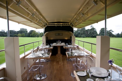 The dining area on the top deck can seat 18 in dark green leather banquettes and Louis Ghost chairs.