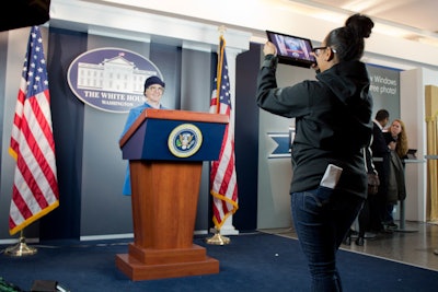 Replicas of the White House press room and the Oval Office sat side by side inside the Rockefeller Plaza concourse. People lined up to have their photos taken by staffers using Windows tablets.