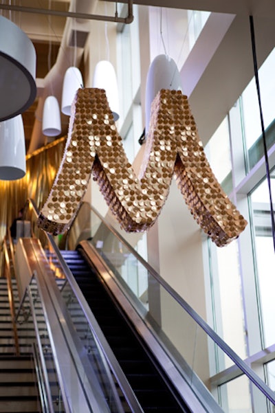 A glittering 'M' for Mariano's hung over the escalator, which led guests to the second floor. Having the event on an upper level created logistical challenges for event staffers, who had to use passenger elevators and coordinate with grocery-store deliverymen to use the freight elevators.