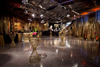 To bring a Studio-54 vibe into the Greektown store, Kehoe Designs brought in gold drapes, shimmering bars, and disco balls.