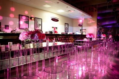 Ghost chairs, flower-topped tables, and swirling pink lights spruced up the deli area.