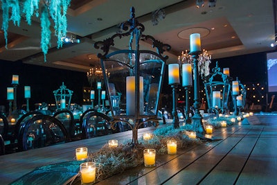 DC Rental provided moss green and black linens for the cocktail tables, which Amaryllis topped with lanterns and candelabras.