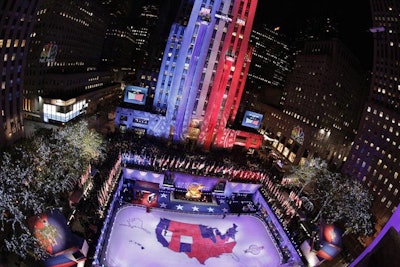 Red and blue banners representing the number of electoral votes gained by each candidate were rolled up the side of the General Electric building, which was illuminated with patriotic lighting projections.