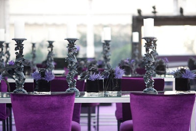 Giving the tables a dramatic look, tall black candlesticks sat alongside Chameleon chairs from Classic.
