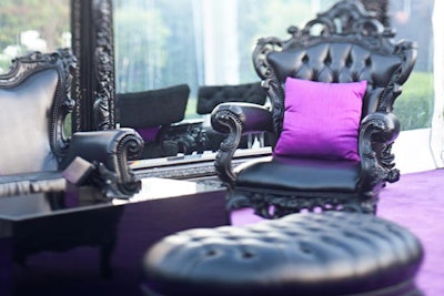 A purple pillow added a pop of color to a dramatic black seating group from Revelry.