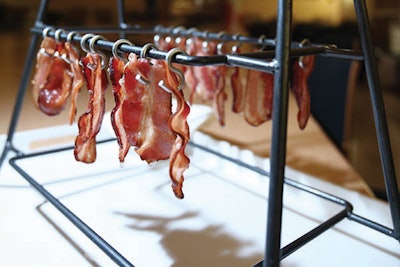 At the MSNBC party after the White House Correspondents’ Dinner, Occasions Caterers served crisp bacon on tiny hooks attached to a metal structure.