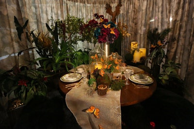 The foresty vignette from Kadlec Architecture & Design had candles, butterflies, and a floor filled with autumn leaves and glittering pinecones.