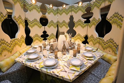 Designed by Jonathan Adler, Kravet Inc.'s table was surrounded by patterned walls with lantern-shape cutouts.
