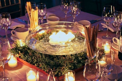 Matthew David Hopkins of 360 Design Events placed bowls of floating candles atop vegetative green roofing tiles at the 9/11 Memorial benefit.