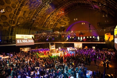 The auction invited guests to move into a space near the stage to pledge funds. Each area was marked by a different color, which indicated a different amount. Pledges started at $200 and went up to $50,000.