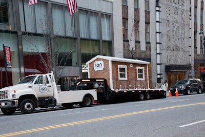 ION's oversize gingerbread house was decorated with thousands of pounds of real ingredients, including brown sugar, icing, ginger, and gummy bears. A wood base and shellac coat prevented the house from being truly edible, but allowed it to withstand winter weather in the city.