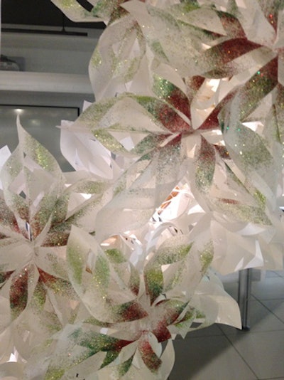 The paper snowflakes from Gettys Group were dusted with green and red glitter.