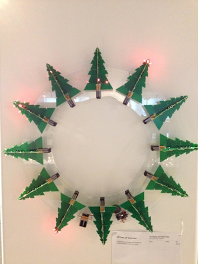 Myefski Architects' wreath, called '12 Trees of Tech-Mas,' contained miniature trees made of digital chips. A custom acrylic frame held all of the trees, and a mini speaker played holiday tunes.