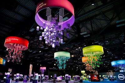 Above the Solutions Showcase, colorful, chandelier-like signage indicated the five topical areas of the floor.
