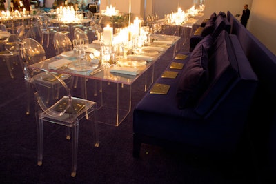 As a way to change up the atrium, a space familiar to the event's guests, the organizers built a raised platform around the perimeter. Long tables and 8-foot couches upholstered in the same indigo blue as the carpeting stood on the level, framing the space.