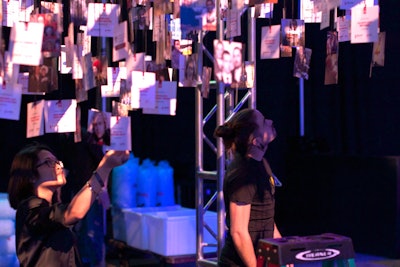 The nonprofit's birthday initiative invited people to ask for donations rather than gifts. The producers printed the amounts raised by different individuals and attached the pieces to a frame, forming a chandelier-like canopy.