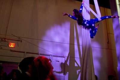 Between the end of dinner and the start of the after-party, the gala screened the short film Entr'acte, which was originally shown during Relâche's intermission. Aerial acrobats followed, performing from long white strips of fabric hung from the ceiling.