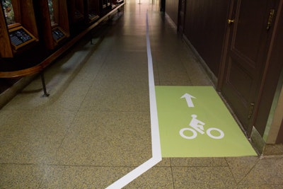 Decals on the floor of the museum mimicked a bike trail, which guided guests from the theater to the party space.