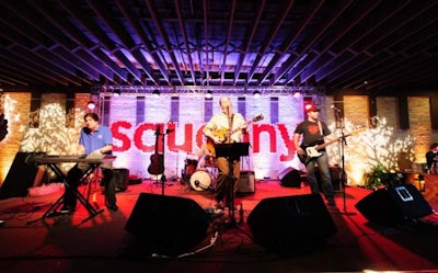 The Shinyribs, an Austin-based band played at the event. The stage backdrop had red Solo cups spelling out 'Saucony.'