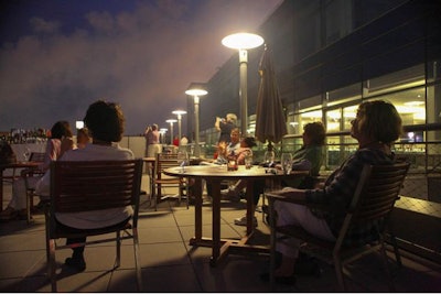 Guests gaze at Fourth of July fireworks from a gorgeous view.