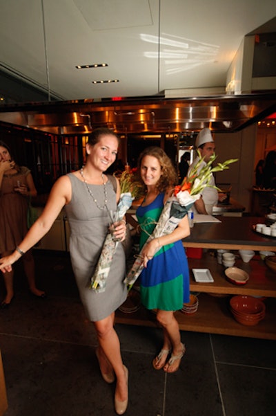 Guests pose with gifts as they enter the venue.