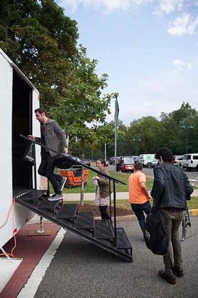 Bands load the stage from behind for the upcoming show.