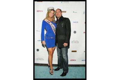 Miss Florida in front of a backdrop for the Ovarian Cancer Foundation