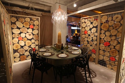 In November at Diffa's annual Dining by Design event at Chicago's Merchandise Mart, the table Hok designed for Halcon had a winter forest feel. Walls were lined with logs, and the chandelier was covered in twigs.