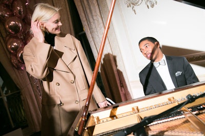 Pianist Christian Sands performed live in the music room. Unlike past presentations, where music has been a central focus, the entertainment was meant to play a more discreet role so as not to aesthetically overpower the garments or the artists in the drawing room.
