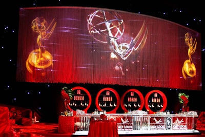 The theme of the Emmys Governors Ball in September was 'A Romantic Rhapsody in Red' and saw the Los Angeles Convention Center's West Hall designed to look like the inside of a red rose. Red rose petals were suspended in the sculpted ice bars, sponsored by Grey Goose.