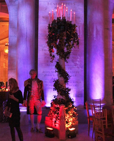 The organizers secured permission from the library to replace the lights in the venue's standing candelabra with flickering ones. Staffers in footmen costumes from the musical stood still amidst the crowd.