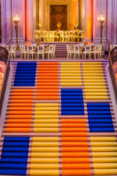 The rotunda staircase was covered in blue, yellow, and orange color-blocked carpets.