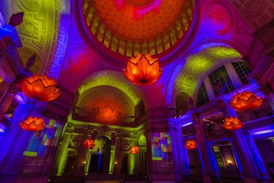 Got Light illuminated the rotunda with eye-popping lighting and compass projections, while hand-sewn silk chandeliers resembling lotus flowers floated overhead.