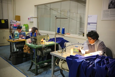 In the Hargrove drape room, employees sew fabrics for decor treatments at the inauguration.