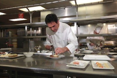 Executive pastry chef Thomas Henzi, who is creating the dessert for the third year, showed off a trio of cappuccino mousse dome, orange sanguine, and chocolate salted caramels, accented with gold leaf.