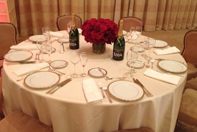 A simple arrangement of lush red roses from Mark's Garden will top camera-friendly, understated tables.