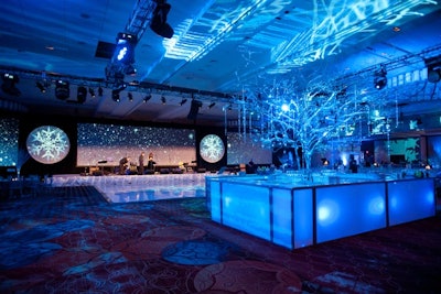 For a winter-themed corporate party, design director Andrew Zill of Baltimore-based Feats Inc. created a snowy scene that included a glowing bar anchored by a crystal-flocked tree.