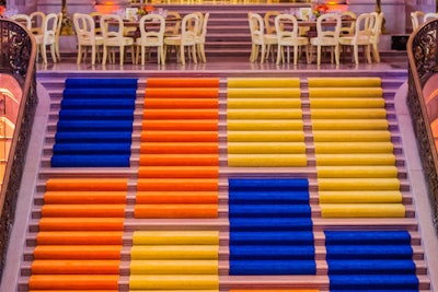 The rotunda staircase was covered in blue, yellow, and orange color-blocked carpets.