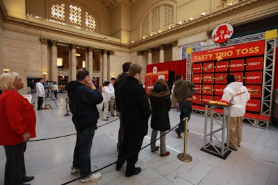 Guests stood in line to play the 'Tasty Trio Toss.'