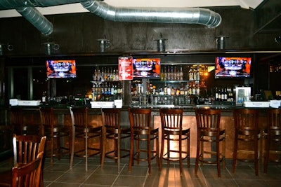 Three bars and 30 TVs fill sports-centric 6th Street Bar Uptown on busy Routh Street. An Austin-inspired menu of burgers, tacos, and sandwiches is served alongside draft beers. Exposed bricks and dark wood fills the main level; the copper-accented second-floor space is available for private events.