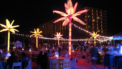 Lighted palm trees and string lighting