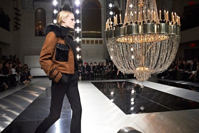 Mixing modern with a little Old-World glamor, Jason Wu's show at 583 Park Avenue was anchored by an enormous chandelier that hung in the center of the square-shaped runway. Sleek black-and-white flooring kept the design from being too fussy at the Bureau Betak-produced event.