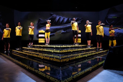Before the presentation began, the wraparound screen behind the stage projected a timeline of shoe images, evoking the history of the Adidas brand.